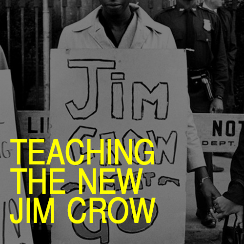 Person holding a sign that says "Jim Crow Must Go"
