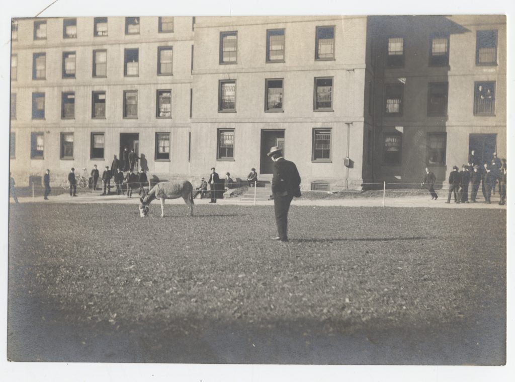 black and white photograph showing a large, multi-story brick building on the Brown University campus