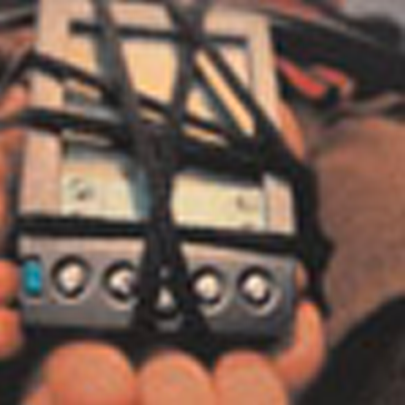 Some kind of electronic device wrapped in wires