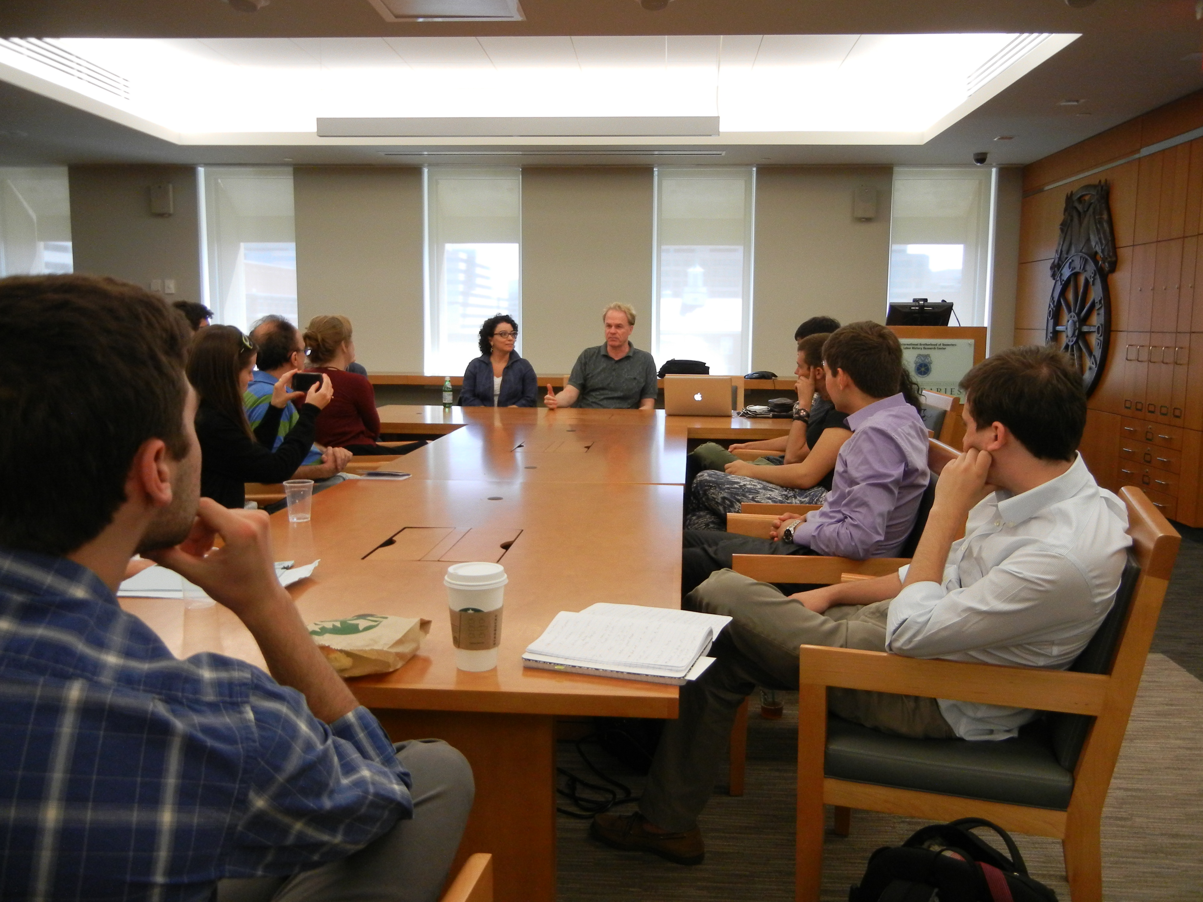 The group meets with Professor James N. Green in Washington, D.C. at the National Archives to speak with Janaina Telles, whose parents were political activists and were tortured during the military dictatorship, and Peter Kornbluh, Director of the National Security Archive's Chile documentation project and Cuba documentation project.