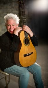 Janis Ian holding guitar