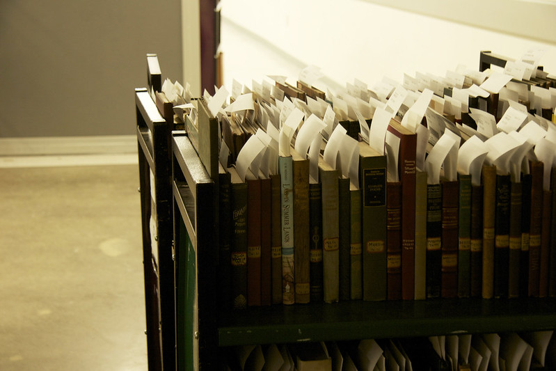 books with processing slips sticking up