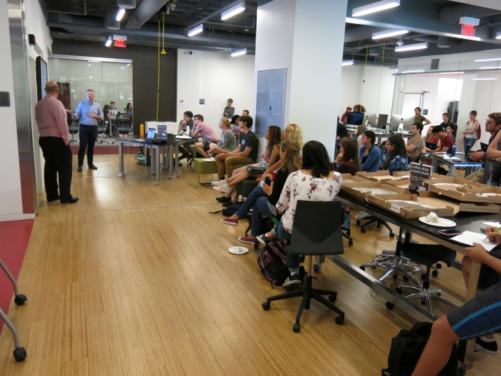 presentation to attendees in digital studio