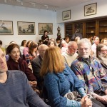 Numerous seated colloguium audience members