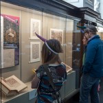 Colloquium attendees viewing exhibit