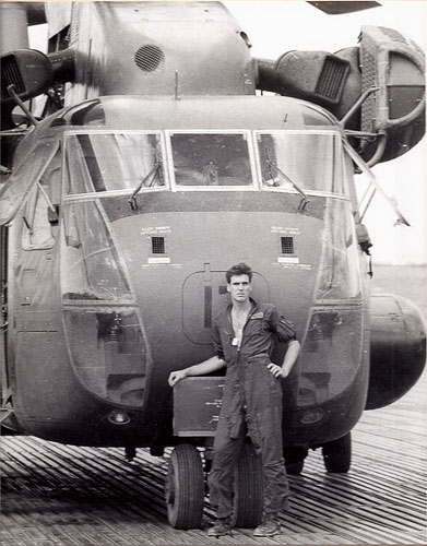 Taylor in front of a helicopter designated det CH-53_001