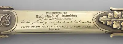 Ceremonial Civil War-era Tiffany sword presented in May 1863 to Col. Rush Hawkins, who led the 9th New York Volunteers — “Hawkins’ Zouaves” — during the first two years of the Civil War. The sword includes a figure of a Zouave carved into the grip and a list of the 9th New York Volunteers’ battles inscribed along the blade.