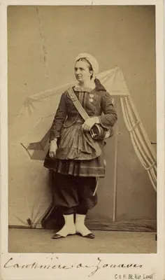 Cartes-de-visite were commonly traded among friends and visitors in the 1860s. The albums that collected and displayed these cards became a common fixture in Victorian parlors. Their relatively low cost contributed to the popularity of the format and its rapid adoption worldwide, which made portrait photographs accessible to a broader demographic. The cards also made the ideal way to remember loved ones fighting in foreign wars, making soldiers frequent clients at photography studios. Prior to the advent of mechanical reproduction of photographs, cartes-de-visite facilitated the dissemination and collection of portraits of prominent persons as an early form of celebrity culture. It is uncertain whether these photographs were given as personal portraits between familiars or as character types of ethnic groups serving in the French Army, which was also a common use of these carte-de-visite, akin to earlier costume album paintings.

All of these cartes-de-visite feature Zouave uniforms, yet only the one portraying Turcos was definitively photographed by a studio in Algiers. Part of the appeal of this cross-cultural uniform was how intentionally difficult it became to discern the ethnic origins of a soldier with certainty (though the titles tirailleurs and turcos often indicated troops of North African descent). Likewise, the popularity of Zouave soldiers — and the women who served as cantinières, or canteen keepers, and who sometimes fought alongside them in battle — spurred many French consumers and performers, including female burlesque dancers, to dress in Zouave costumes for studio portraits. Though a highly exoticizing use of regional fashion, the rising numbers of commercial portraits of civilians donning Zouave costumes attest to how these soldiers and the visual traces of colonization had infiltrated the popular imaginations of French consumers.