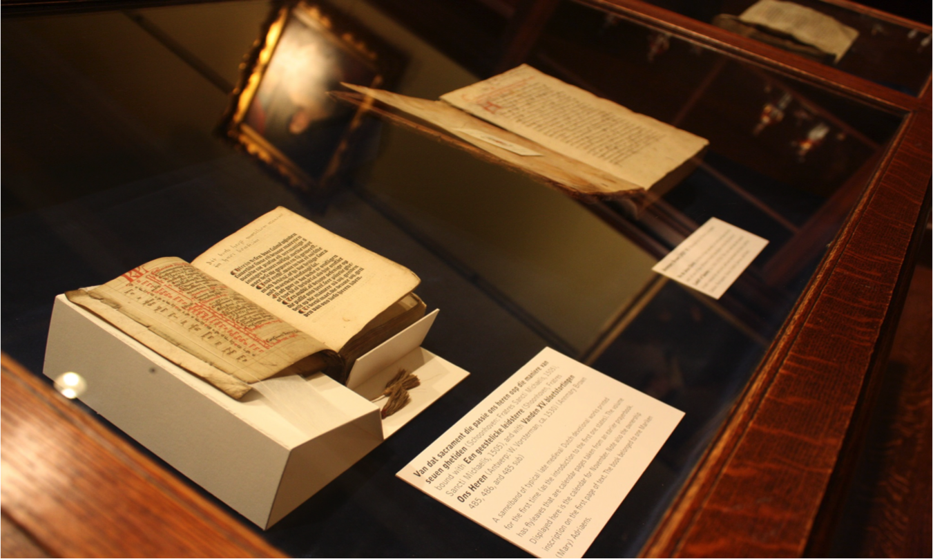 Old books open in an exhibit
