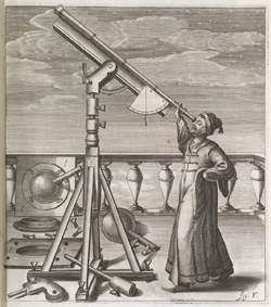 man looking through a telescope