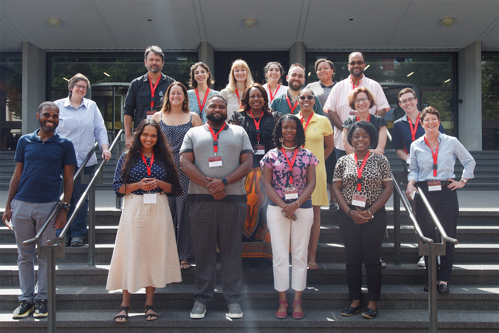 group photo of the 2022 NEH cohort on the steps of the Rockefeller Library at Brown University